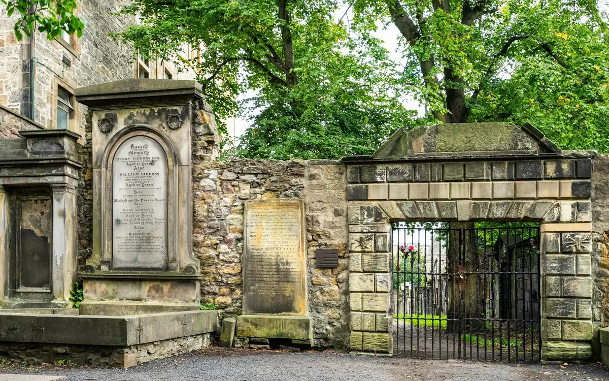 The iron gate of Greyfriars Kirkyard under a street lamp